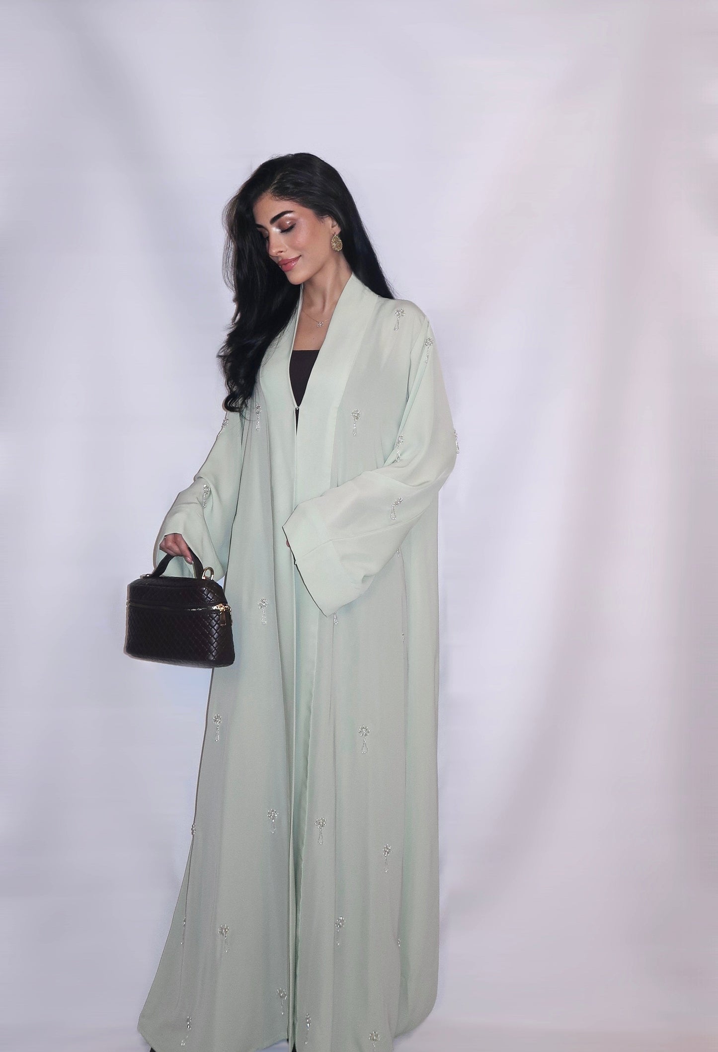 Soft mint nada abaya decorated with hand-beaded crystal and pearl motifs, full length