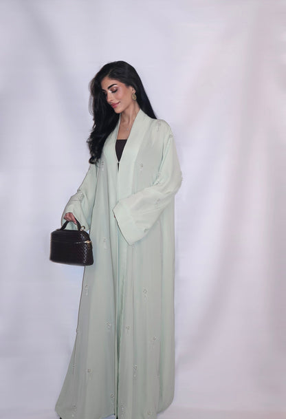 Soft mint nada abaya decorated with hand-beaded crystal and pearl motifs, full length