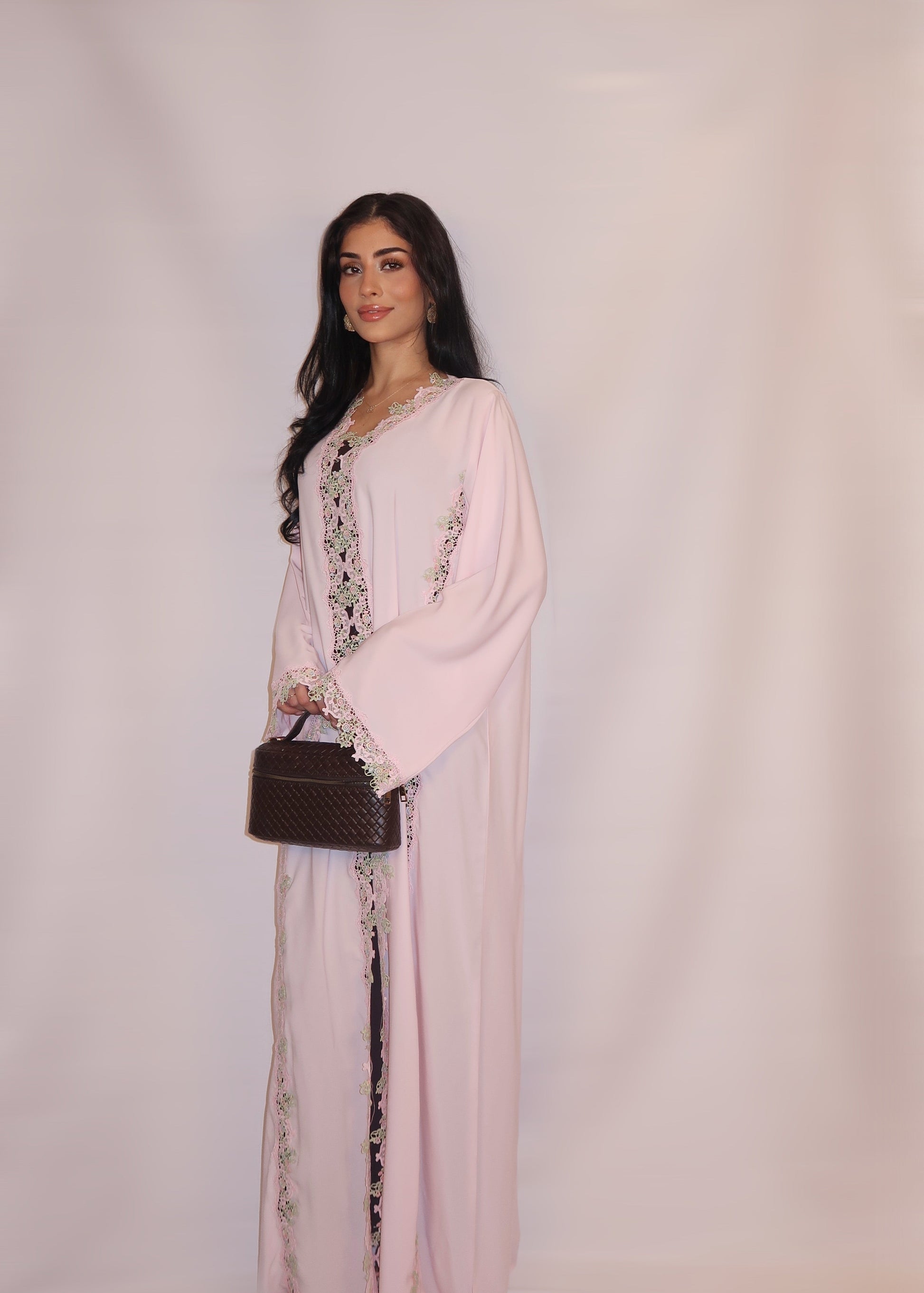 Soft blush-pink nida abaya with floral guipure lace and a pastel yoke, full length