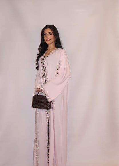 Soft blush-pink nida abaya with floral guipure lace and a pastel yoke, full length