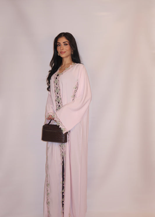 Soft blush-pink nida abaya with floral guipure lace and a pastel yoke, full length